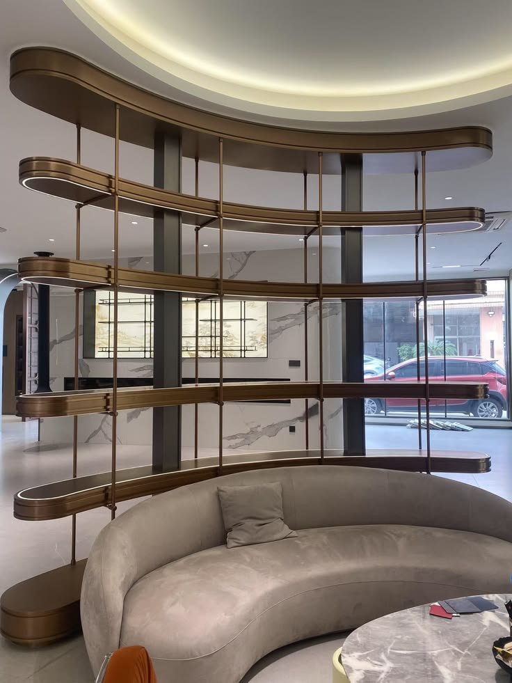 Aanjana Arts curved bronze shelf lobby divider
