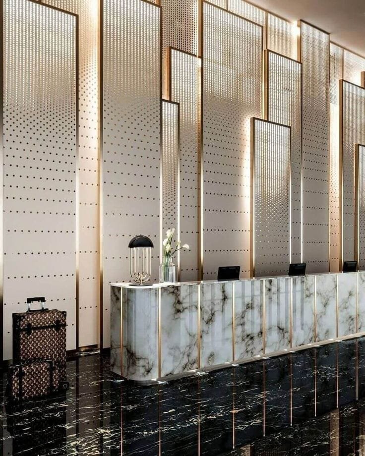 Aanjana Arts perforated gold panel reception counter