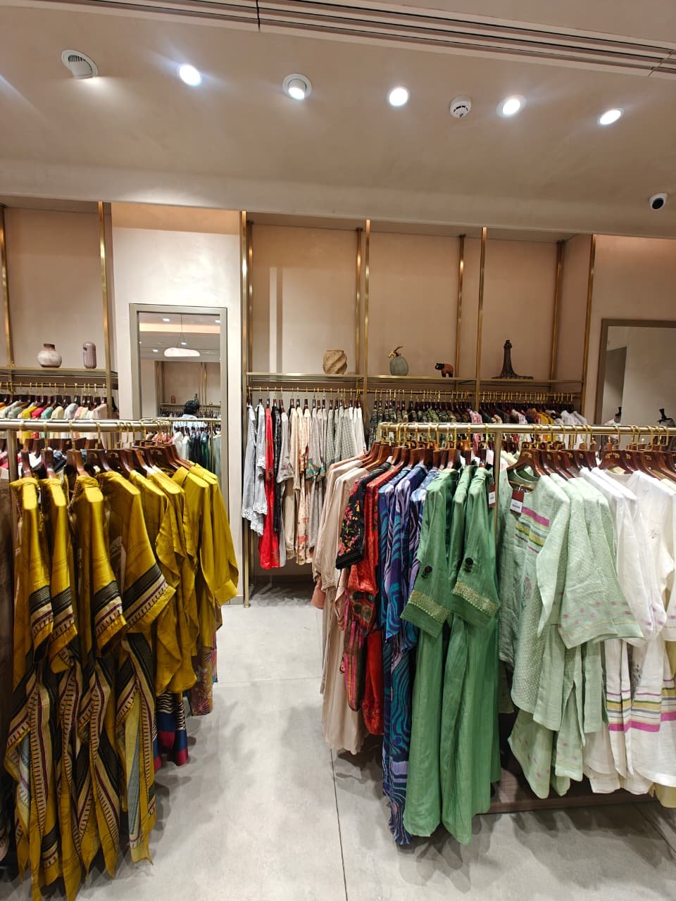 Aanjana Arts multi aisle apparel racks
